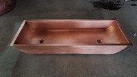 Image Copper Trough Bathroom Sink with Two Drain Holes Shown in Matte Penny